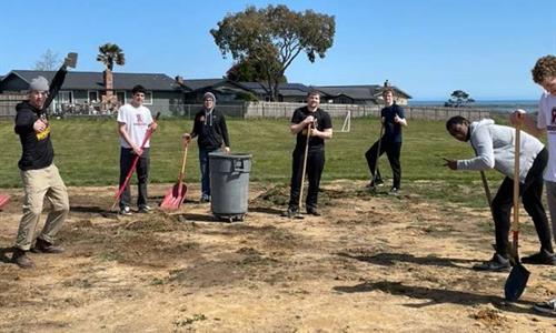 CR Basketball Team Donates Field Maintenance to Local Elementary School